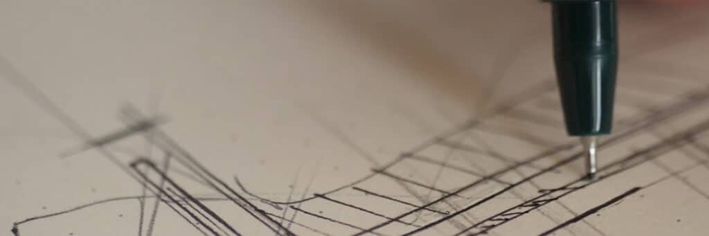 Stylo dessinant un croquis